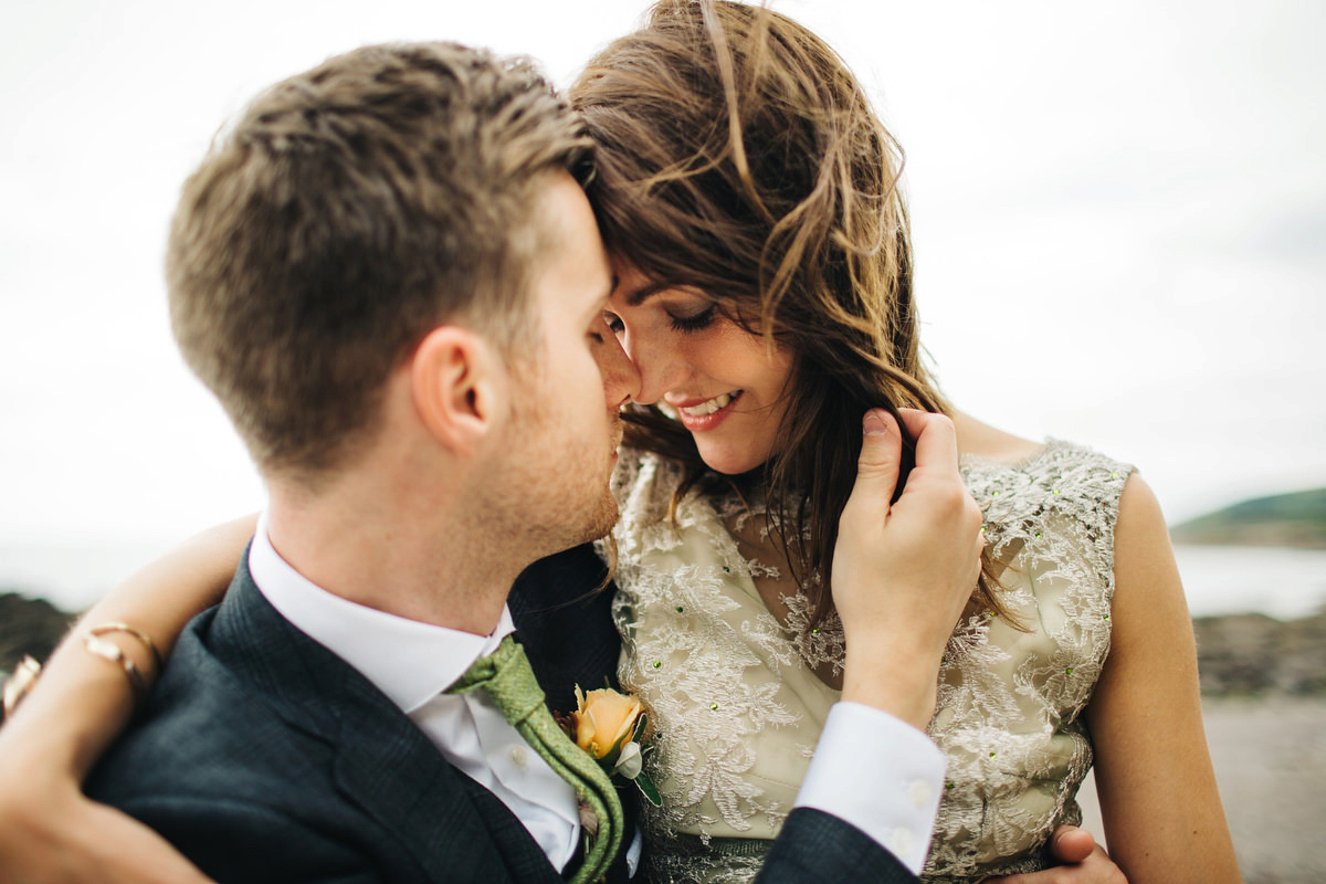 Boho bride Alice wore a pale green lace wedding dress and floral crown for her wild woodland inspired, free spirited South Devon wedding at Langdon Court. Photography by Richard Skins.