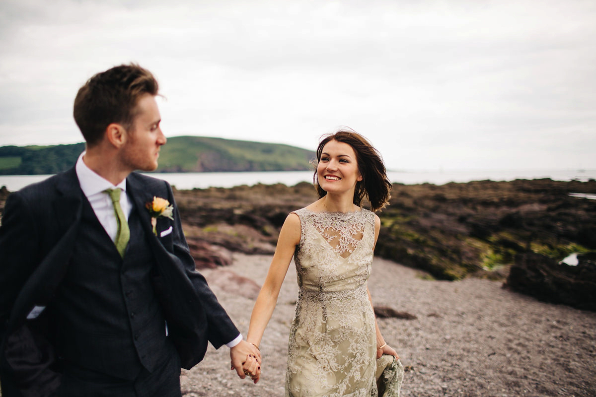 Boho bride Alice wore a pale green lace wedding dress and floral crown for her wild woodland inspired, free spirited South Devon wedding at Langdon Court. Photography by Richard Skins.