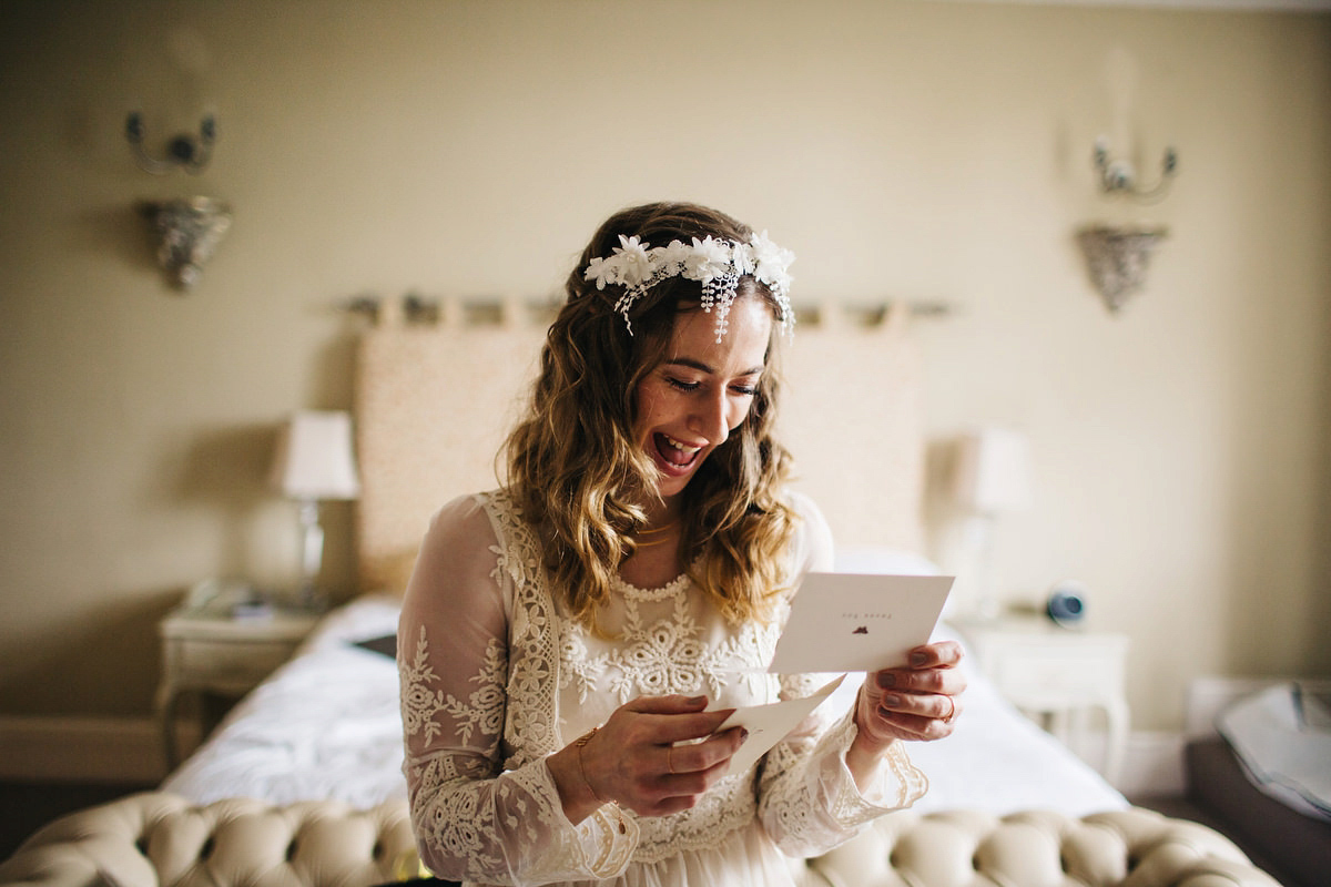 Boho bride Alice wore a pale green lace wedding dress and floral crown for her wild woodland inspired, free spirited South Devon wedding at Langdon Court. Photography by Richard Skins.