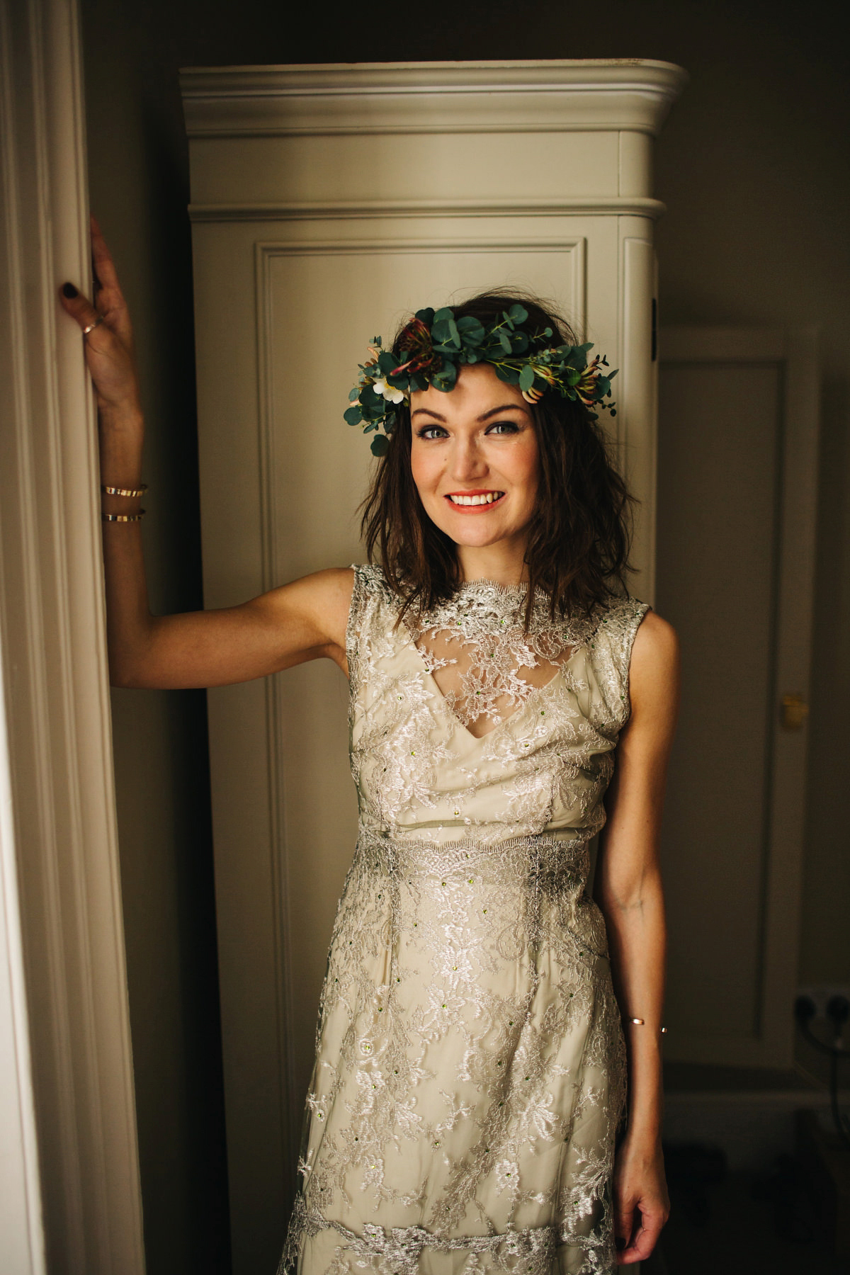 Boho bride Alice wore a pale green lace wedding dress and floral crown for her wild woodland inspired, free spirited South Devon wedding at Langdon Court. Photography by Richard Skins.