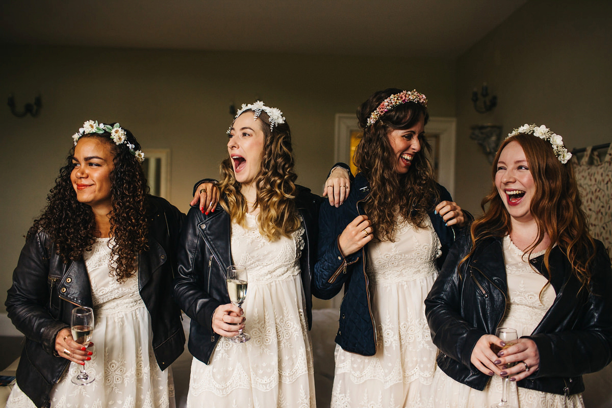 Boho bride Alice wore a pale green lace wedding dress and floral crown for her wild woodland inspired, free spirited South Devon wedding at Langdon Court. Photography by Richard Skins.