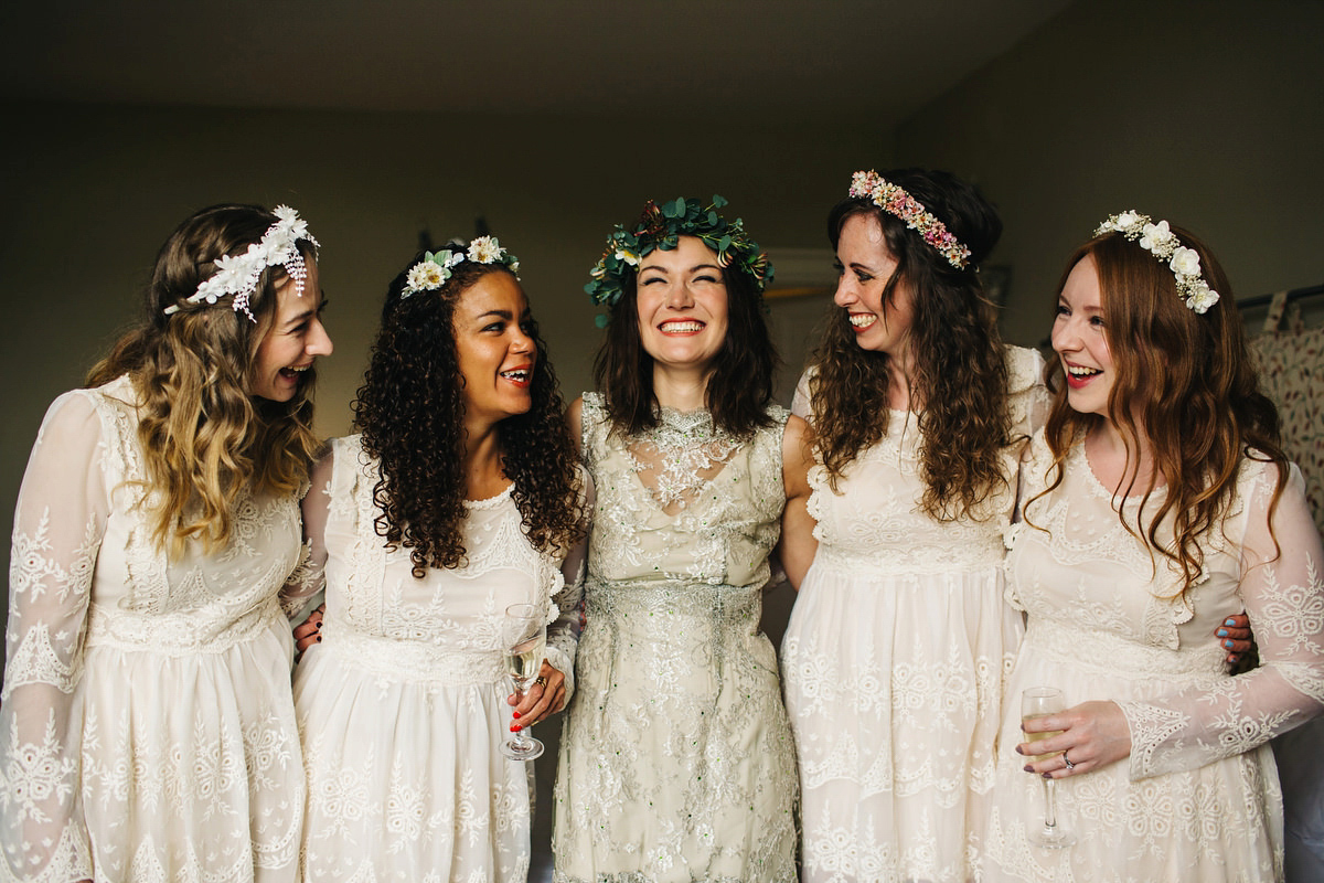 Boho bride Alice wore a pale green lace wedding dress and floral crown for her wild woodland inspired, free spirited South Devon wedding at Langdon Court. Photography by Richard Skins.