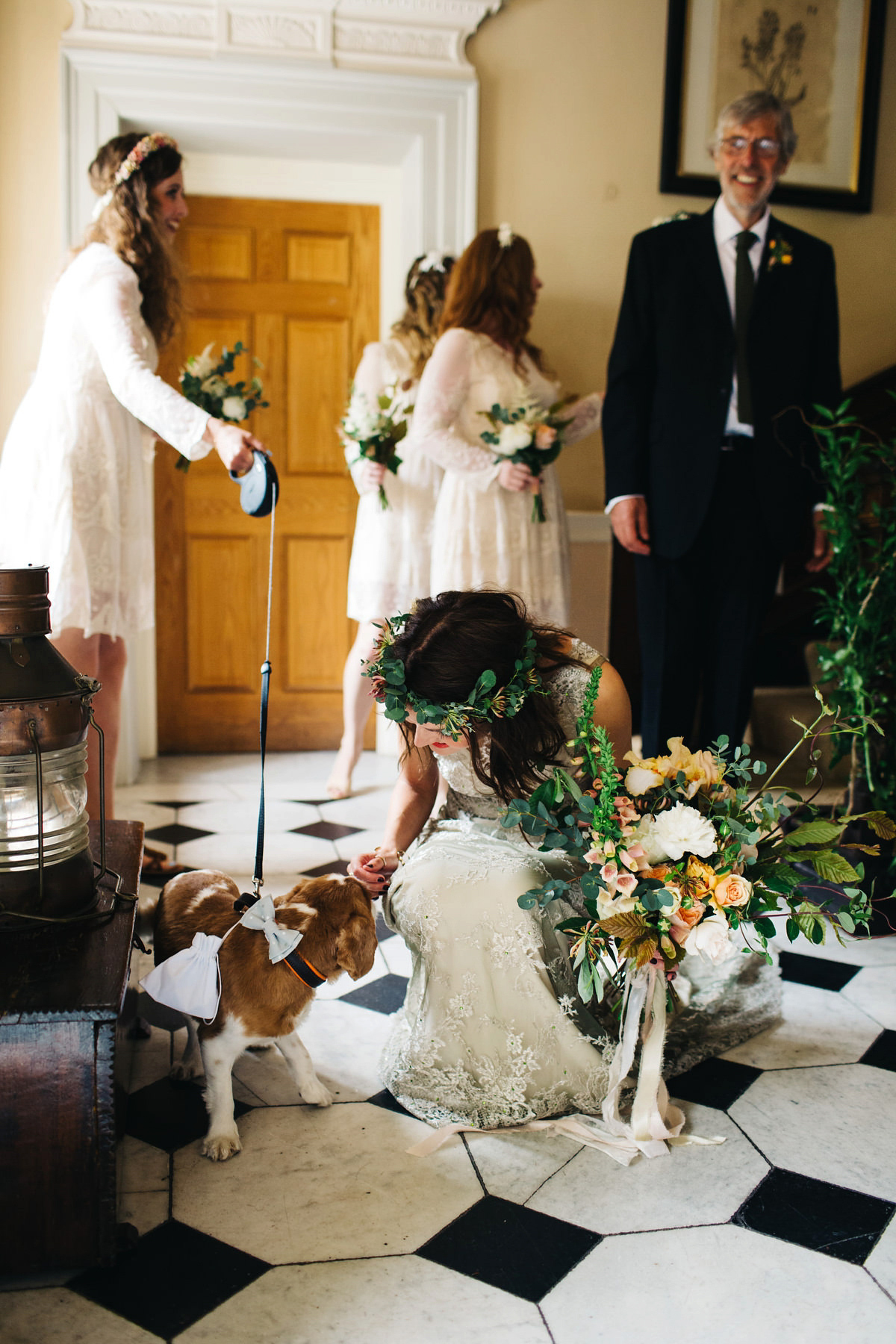 Boho bride Alice wore a pale green lace wedding dress and floral crown for her wild woodland inspired, free spirited South Devon wedding at Langdon Court. Photography by Richard Skins.