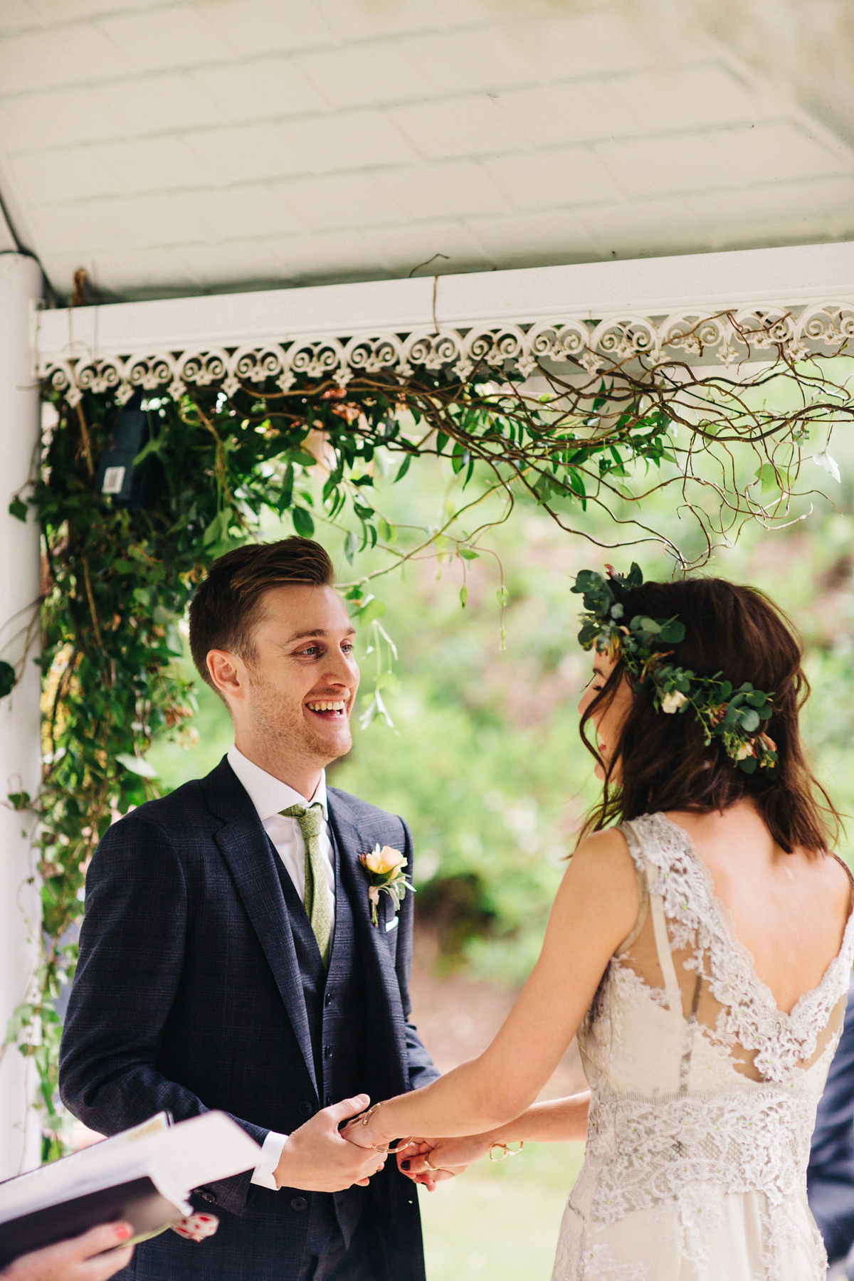 Boho bride Alice wore a pale green lace wedding dress and floral crown for her wild woodland inspired, free spirited South Devon wedding at Langdon Court. Photography by Richard Skins.