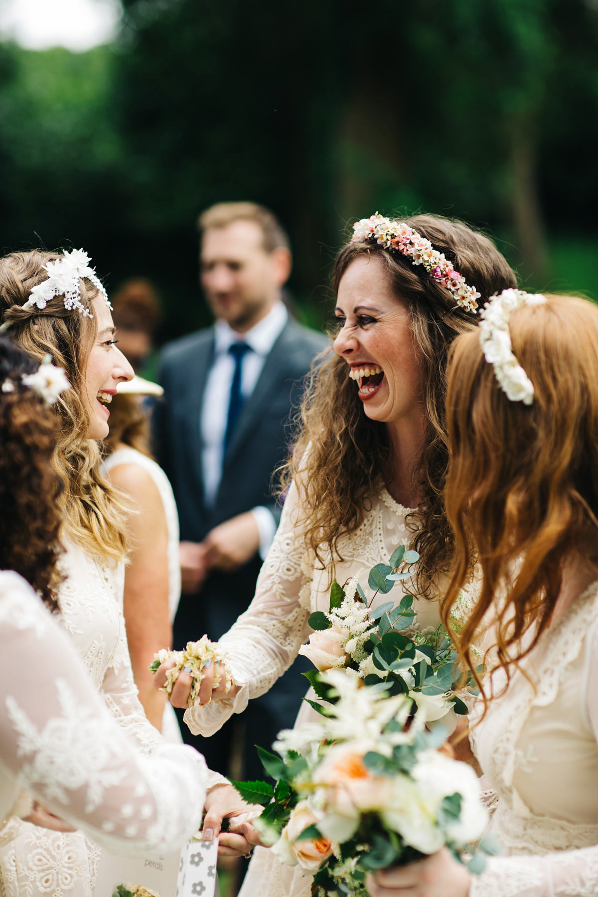 Boho bride Alice wore a pale green lace wedding dress and floral crown for her wild woodland inspired, free spirited South Devon wedding at Langdon Court. Photography by Richard Skins.