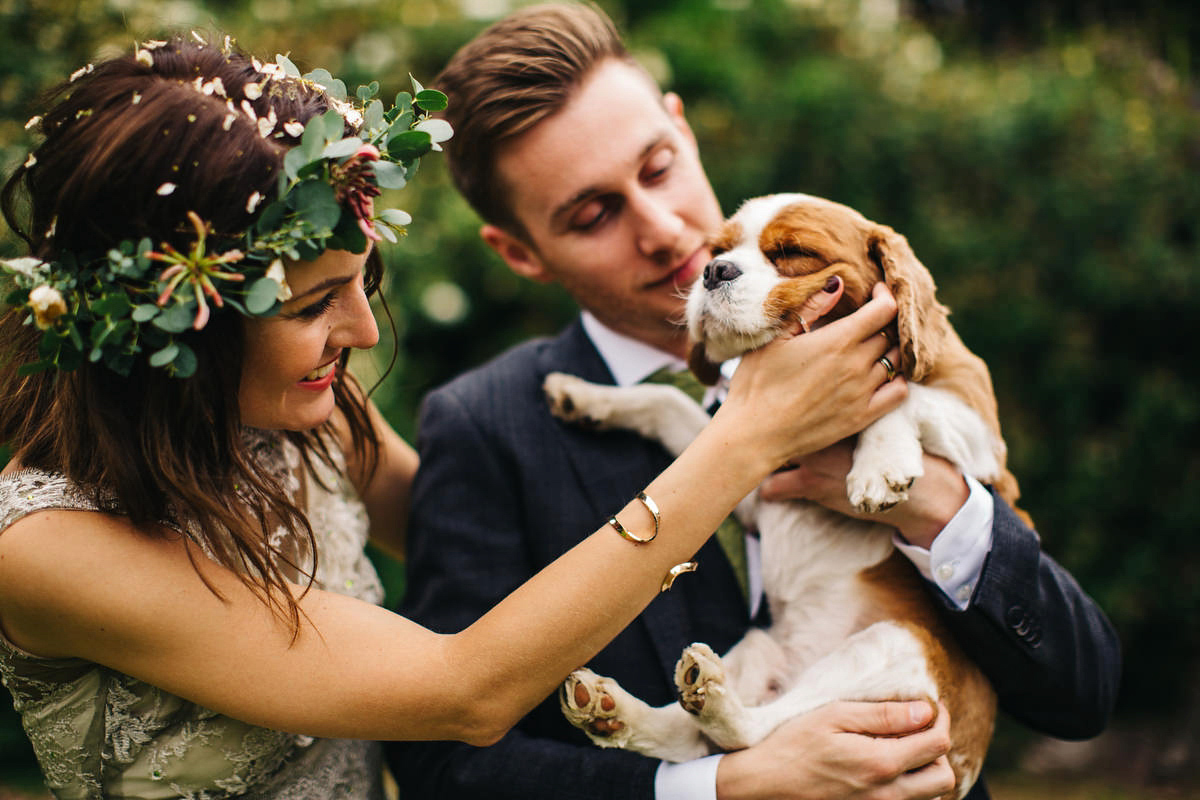 Boho bride Alice wore a pale green lace wedding dress and floral crown for her wild woodland inspired, free spirited South Devon wedding at Langdon Court. Photography by Richard Skins.