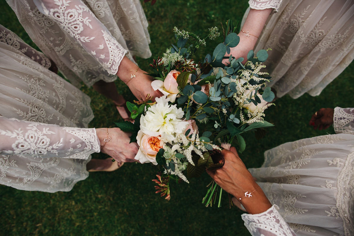 Boho bride Alice wore a pale green lace wedding dress and floral crown for her wild woodland inspired, free spirited South Devon wedding at Langdon Court. Photography by Richard Skins.