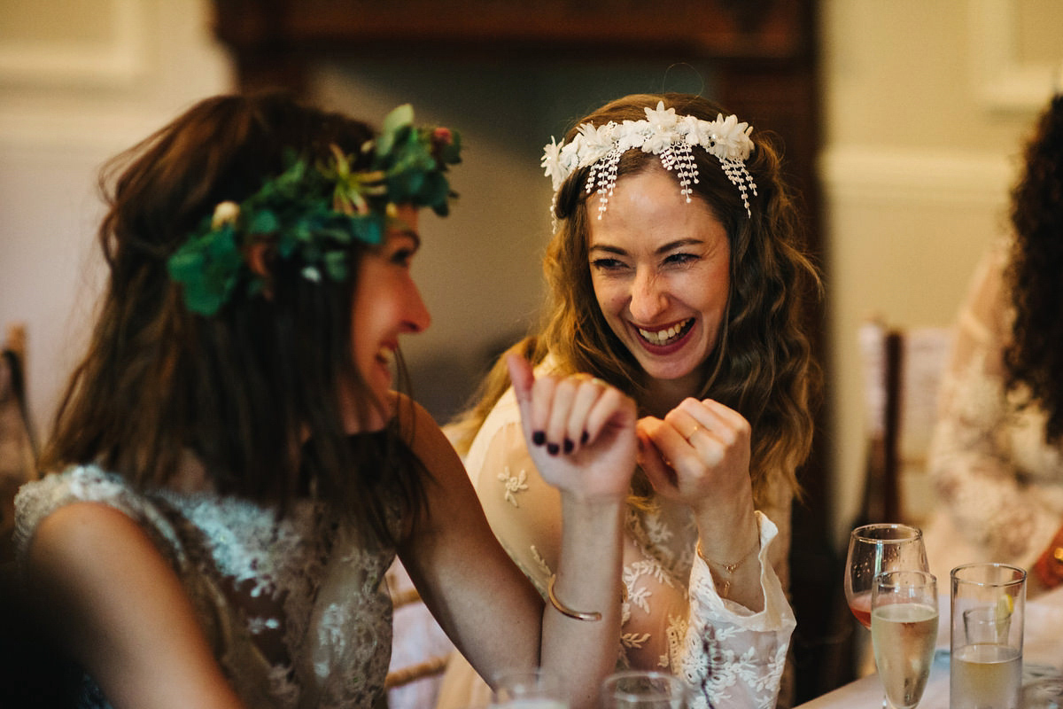 Boho bride Alice wore a pale green lace wedding dress and floral crown for her wild woodland inspired, free spirited South Devon wedding at Langdon Court. Photography by Richard Skins.