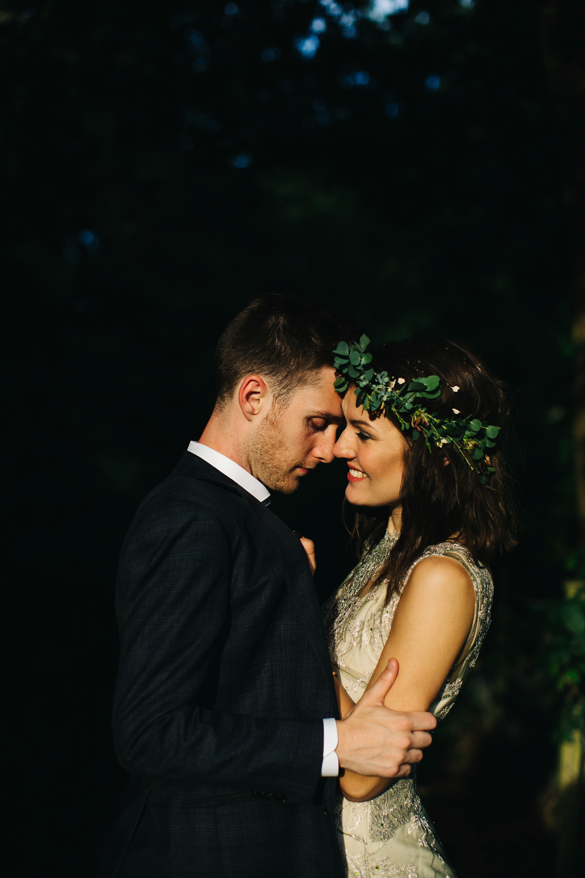 Boho bride Alice wore a pale green lace wedding dress and floral crown for her wild woodland inspired, free spirited South Devon wedding at Langdon Court. Photography by Richard Skins.