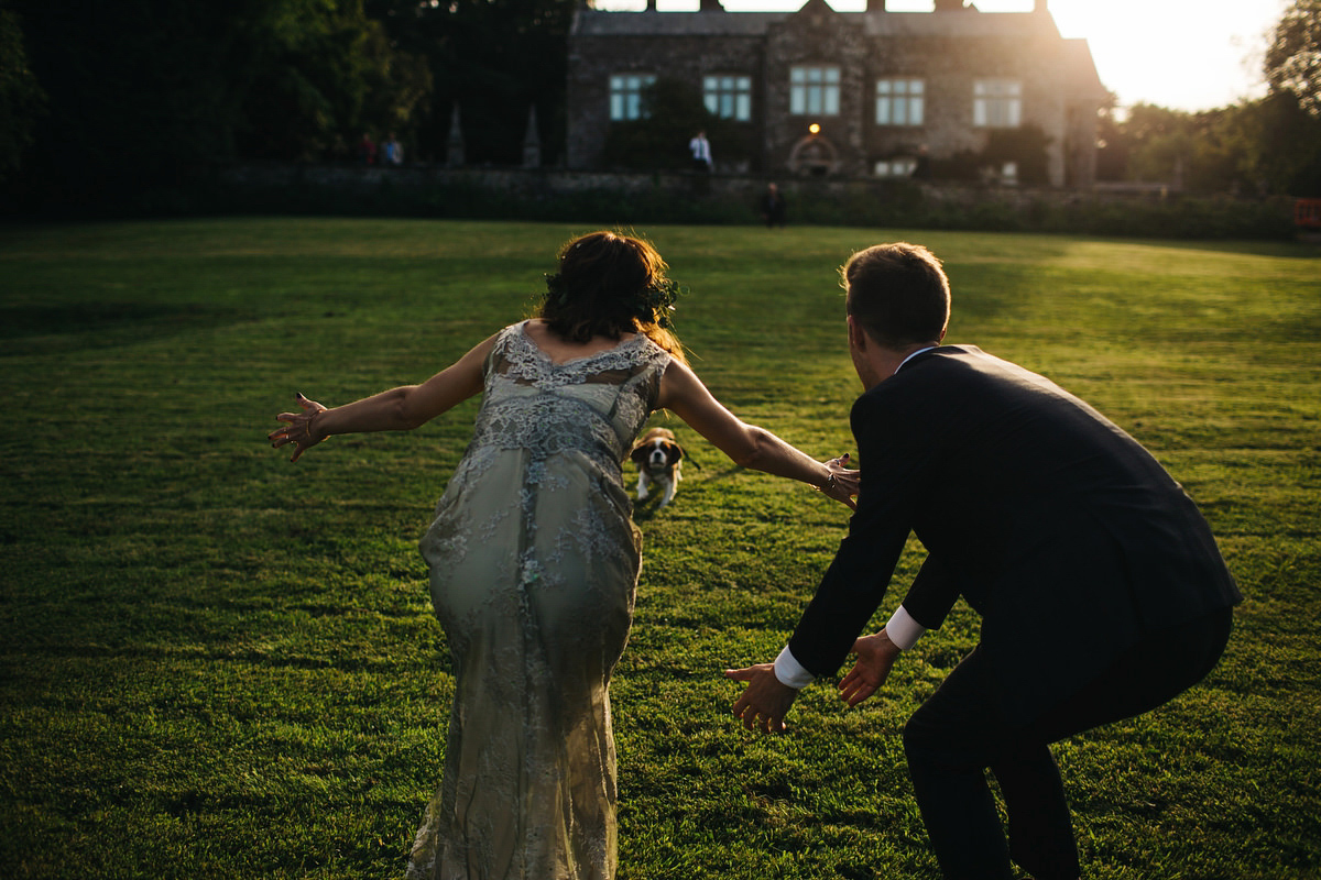 Boho bride Alice wore a pale green lace wedding dress and floral crown for her wild woodland inspired, free spirited South Devon wedding at Langdon Court. Photography by Richard Skins.