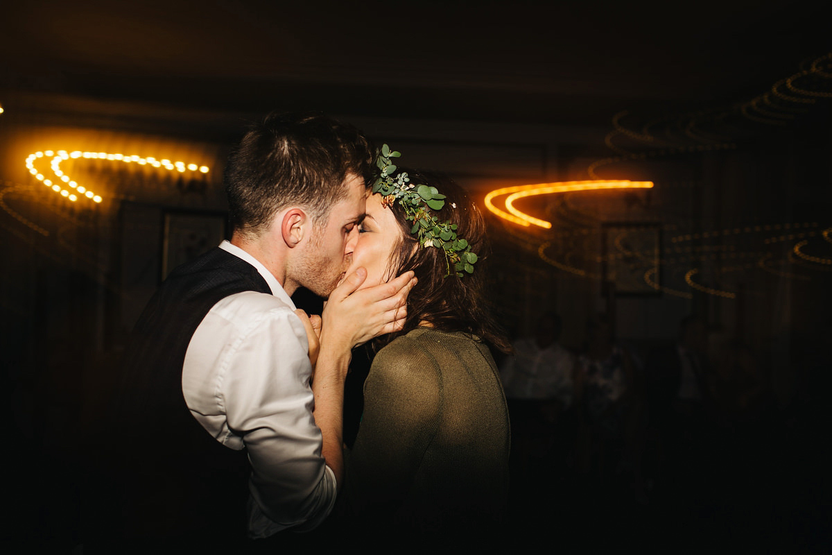 Boho bride Alice wore a pale green lace wedding dress and floral crown for her wild woodland inspired, free spirited South Devon wedding at Langdon Court. Photography by Richard Skins.