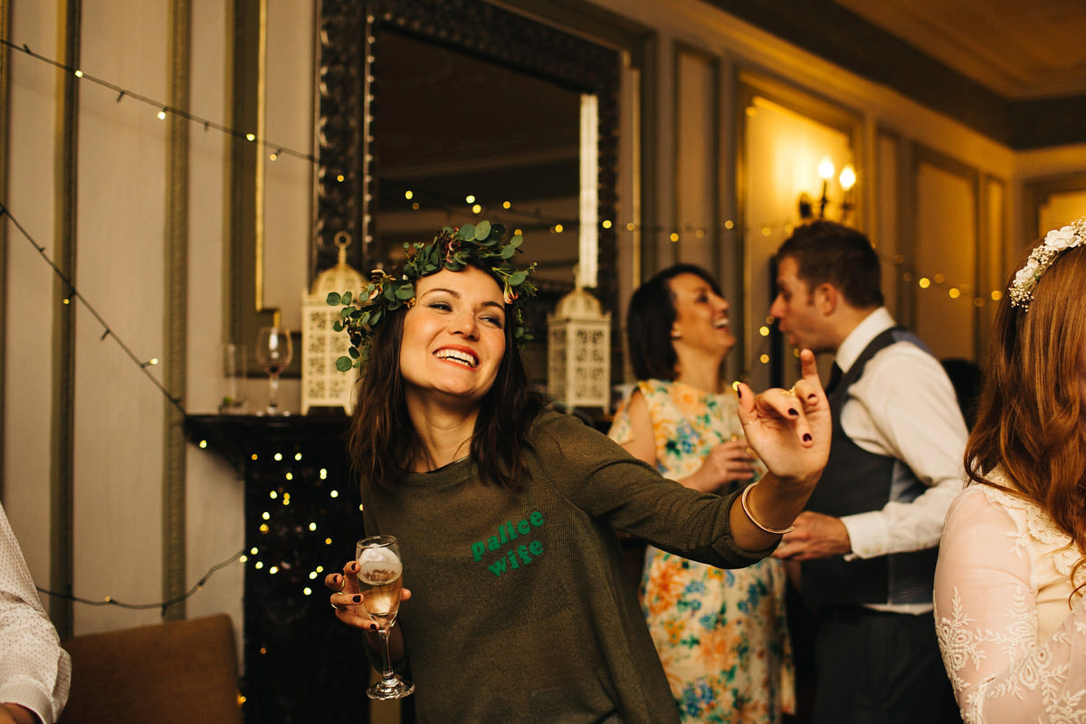 Boho bride Alice wore a pale green lace wedding dress and floral crown for her wild woodland inspired, free spirited South Devon wedding at Langdon Court. Photography by Richard Skins.