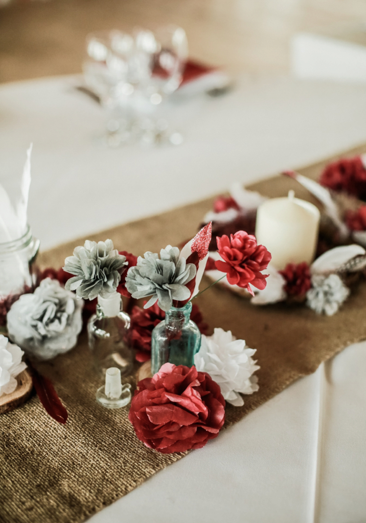 Gillian wore a short lace John Lewis wedding dress and a feather in her hair for her nature inspired Autumn wedding at London Wetlands Centre. Images by Kristida Photography.