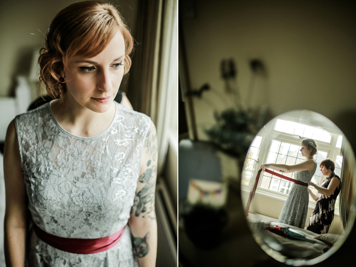 Gillian wore a short lace John Lewis wedding dress and a feather in her hair for her nature inspired Autumn wedding at London Wetlands Centre. Images by Kristida Photography.