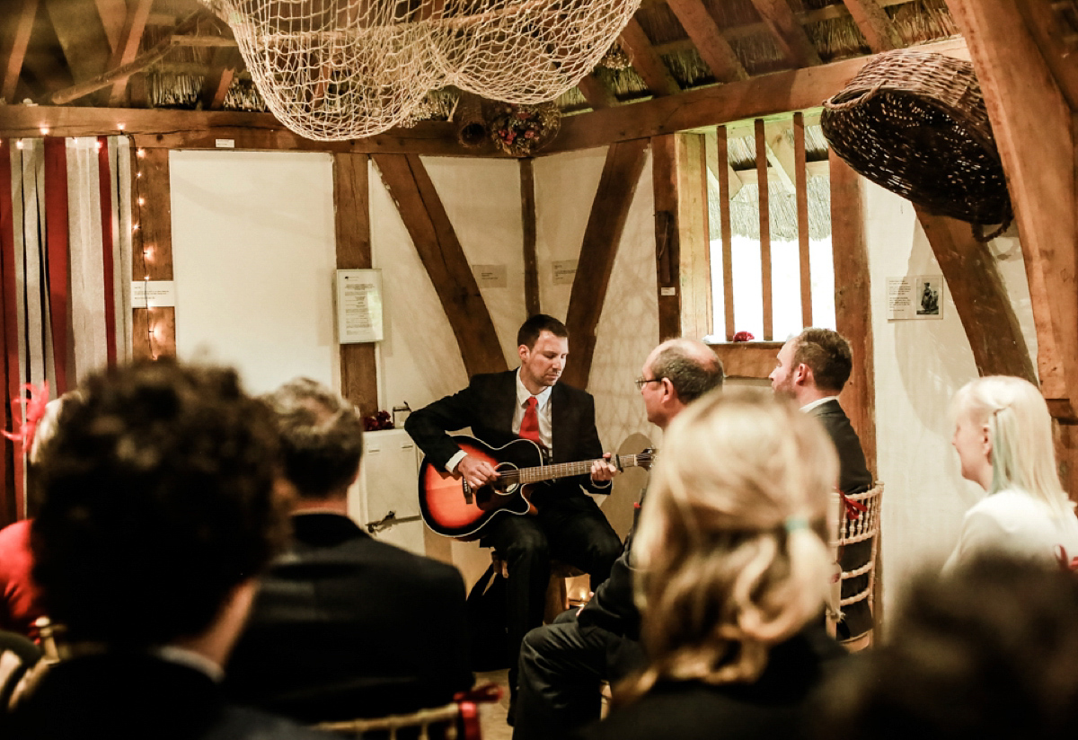 Gillian wore a short lace John Lewis wedding dress and a feather in her hair for her nature inspired Autumn wedding at London Wetlands Centre. Images by Kristida Photography.