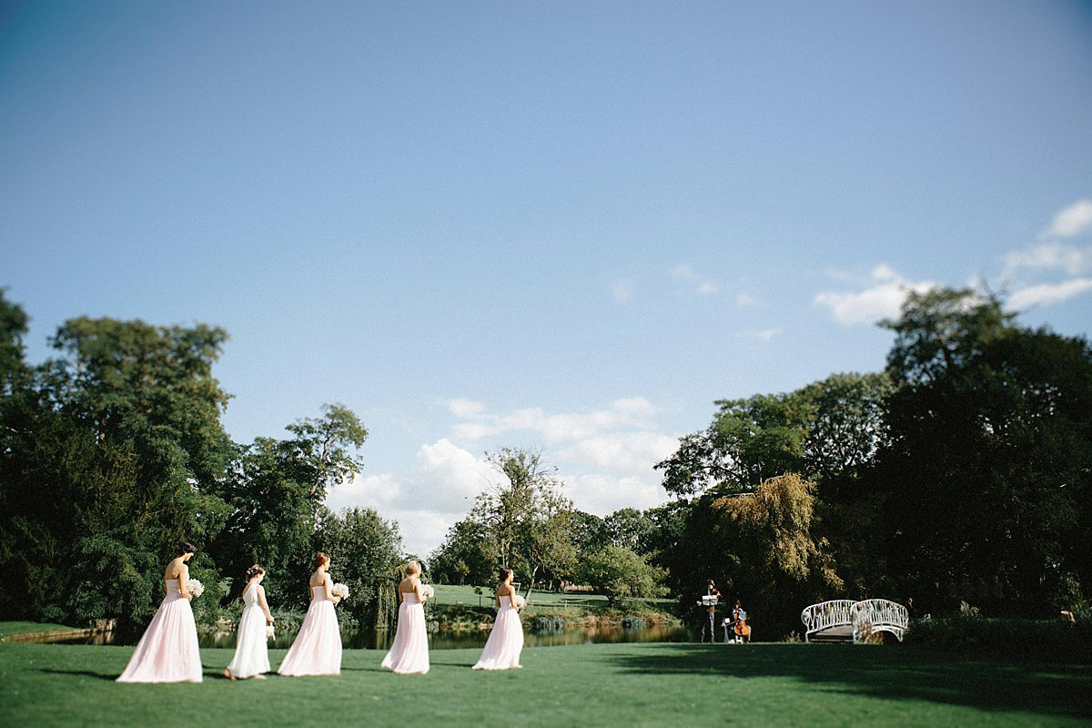 Lauren wore an Enzoani gown and a fishtail braid for her pretty, pastel colour Autumn wedding at Preston Court. Photography by Jacob & Pauline.