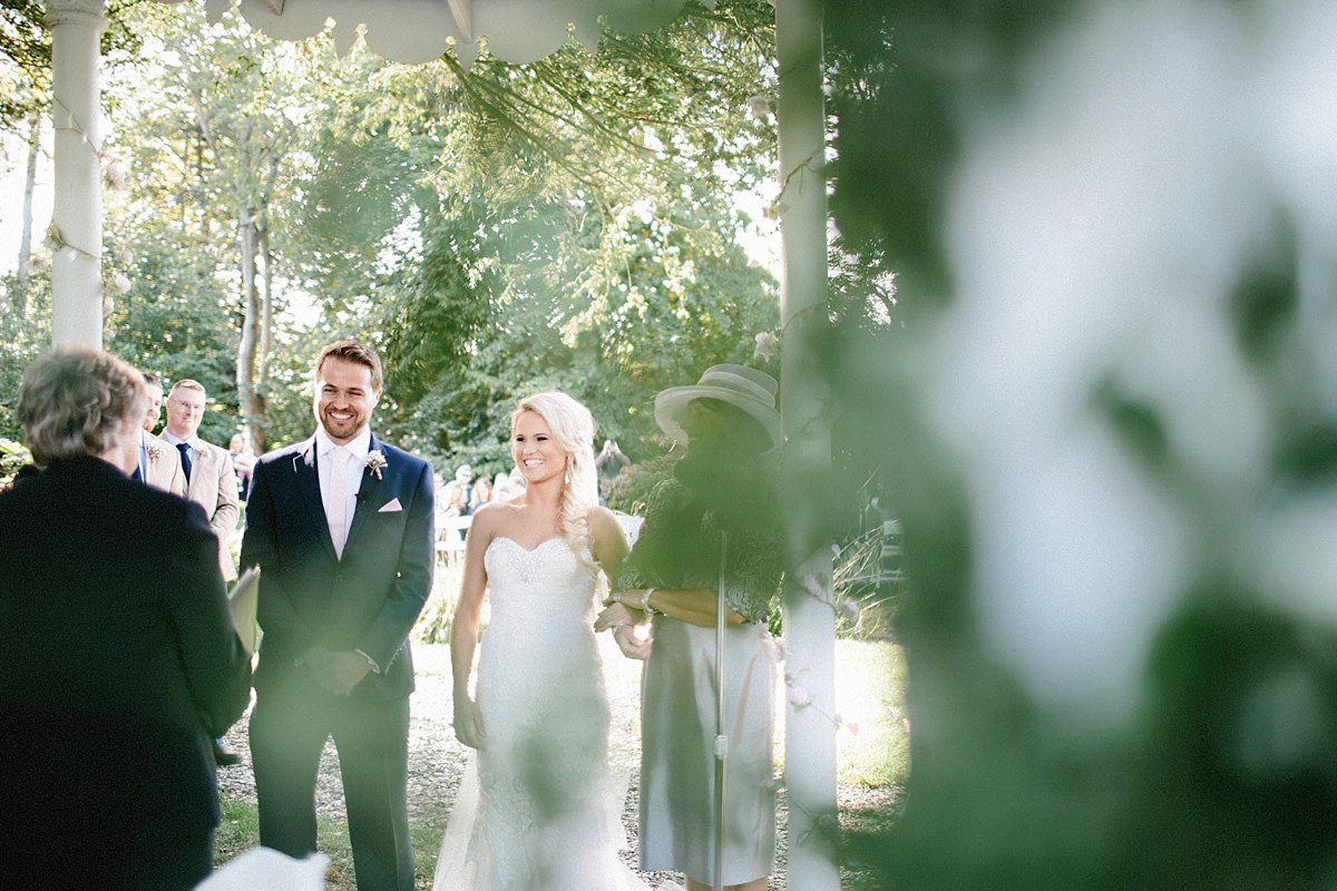 Lauren wore an Enzoani gown and a fishtail braid for her pretty, pastel colour Autumn wedding at Preston Court. Photography by Jacob & Pauline.