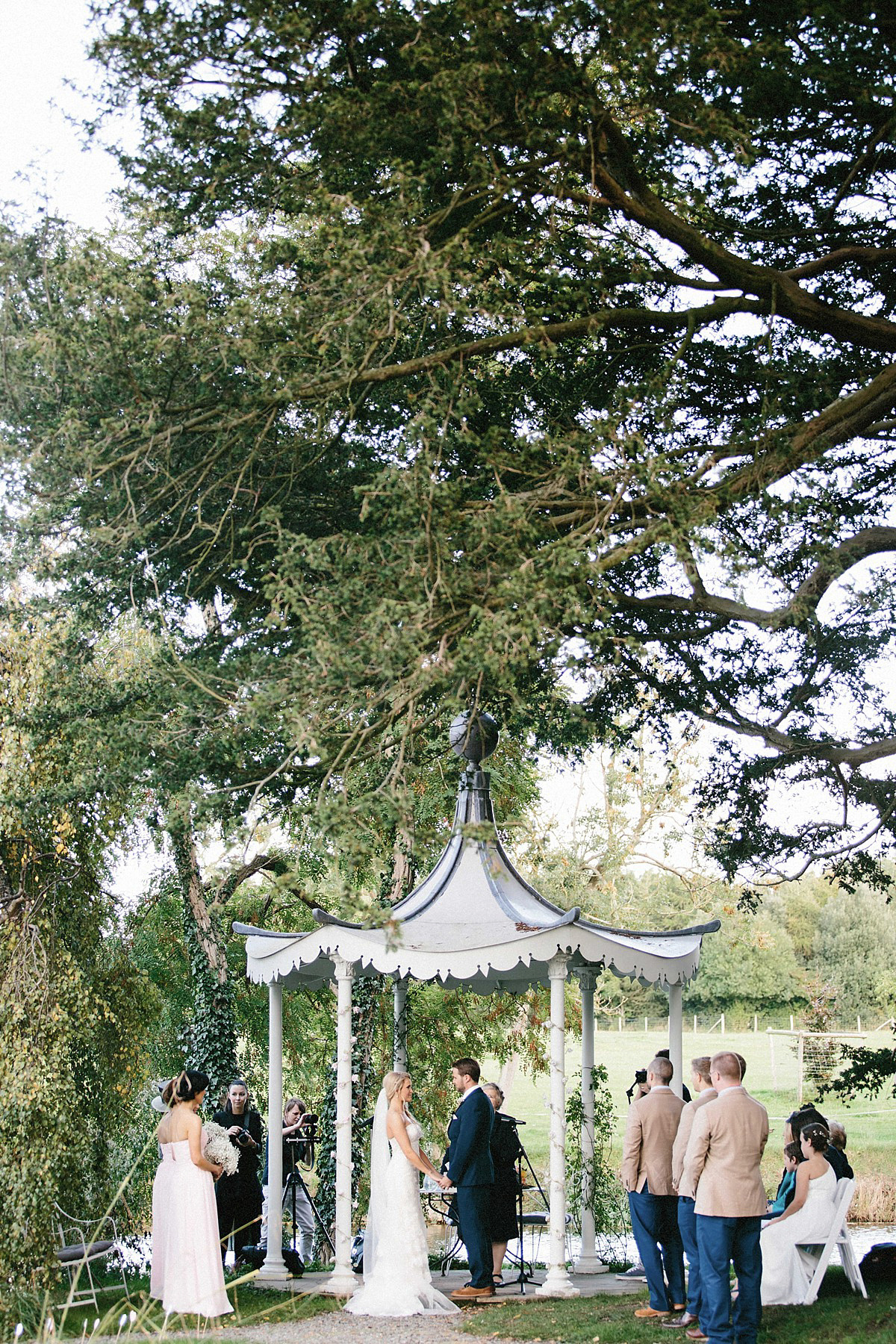 Lauren wore an Enzoani gown and a fishtail braid for her pretty, pastel colour Autumn wedding at Preston Court. Photography by Jacob & Pauline.