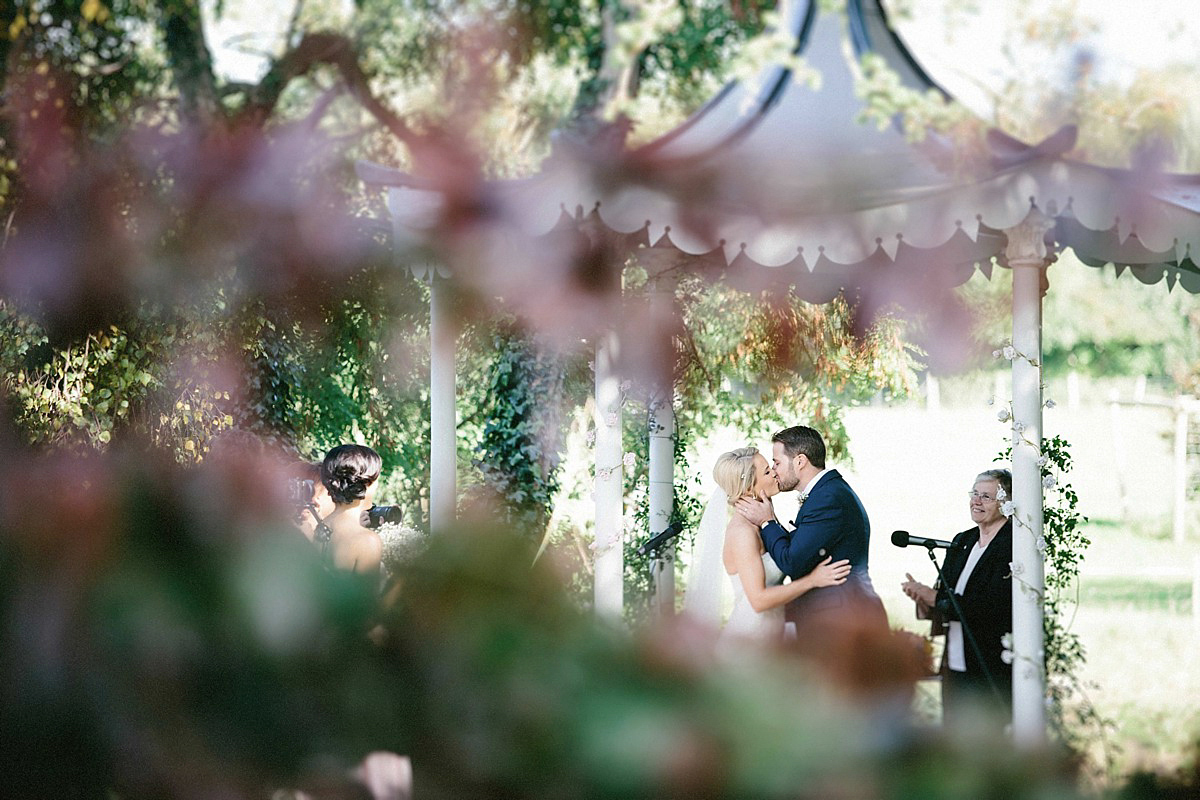 Lauren wore an Enzoani gown and a fishtail braid for her pretty, pastel colour Autumn wedding at Preston Court. Photography by Jacob & Pauline.