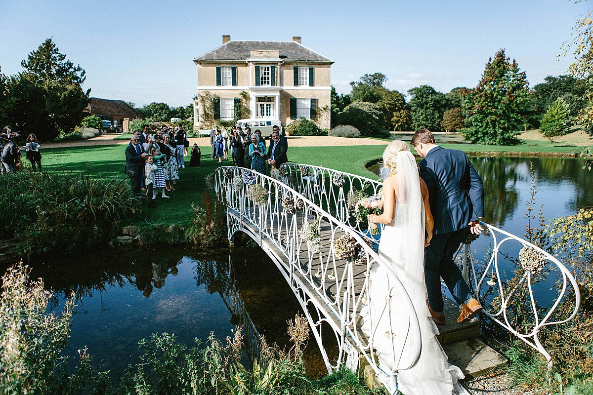 Lauren wore an Enzoani gown and a fishtail braid for her pretty, pastel colour Autumn wedding at Preston Court. Photography by Jacob & Pauline.