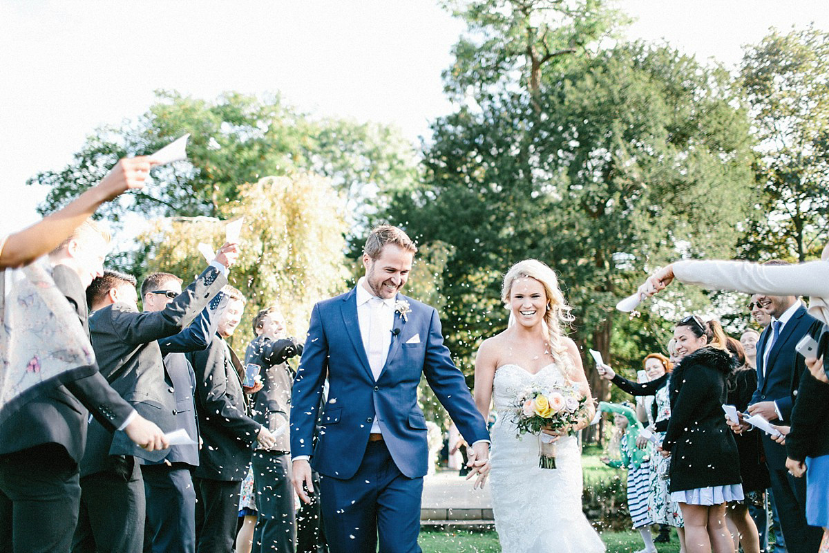 Lauren wore an Enzoani gown and a fishtail braid for her pretty, pastel colour Autumn wedding at Preston Court. Photography by Jacob & Pauline.