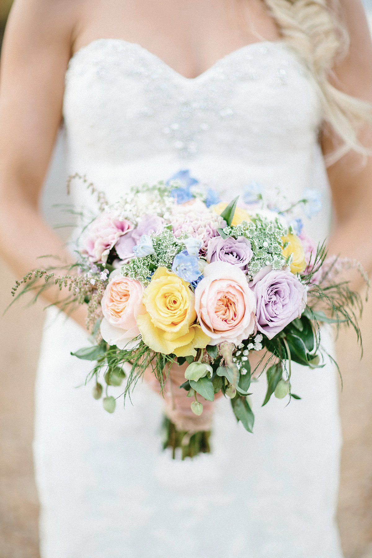 Lauren wore an Enzoani gown and a fishtail braid for her pretty, pastel colour Autumn wedding at Preston Court. Photography by Jacob & Pauline.