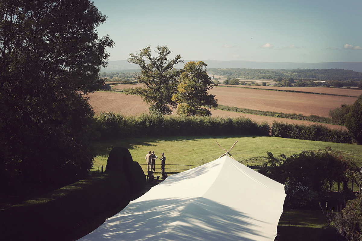 Ellie's wears a 1920's drop waist vintage dress for her outdoor, Autumn, Humanist wedding ceremony at Dewsall Court. Images by Bullit Photography.