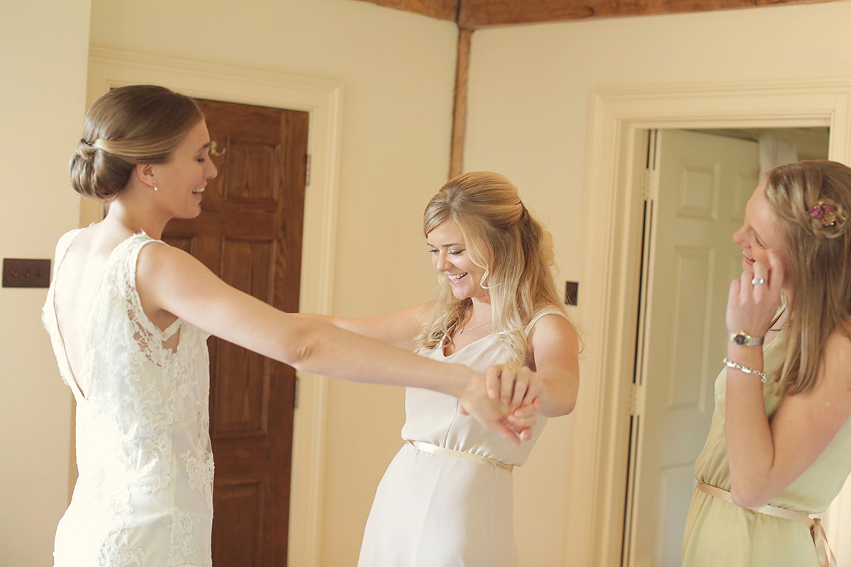 Ellie's wears a 1920's drop waist vintage dress for her outdoor, Autumn, Humanist wedding ceremony at Dewsall Court. Images by Bullit Photography.