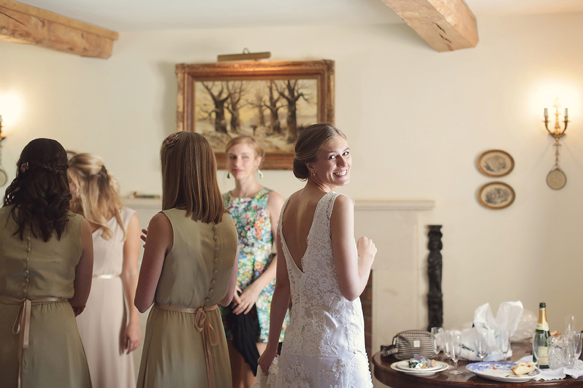 Ellie's wears a 1920's drop waist vintage dress for her outdoor, Autumn, Humanist wedding ceremony at Dewsall Court. Images by Bullit Photography.