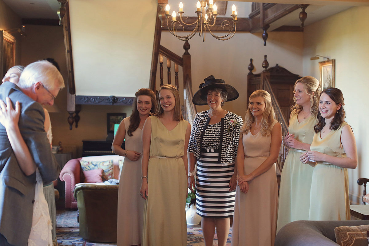 Ellie's wears a 1920's drop waist vintage dress for her outdoor, Autumn, Humanist wedding ceremony at Dewsall Court. Images by Bullit Photography.