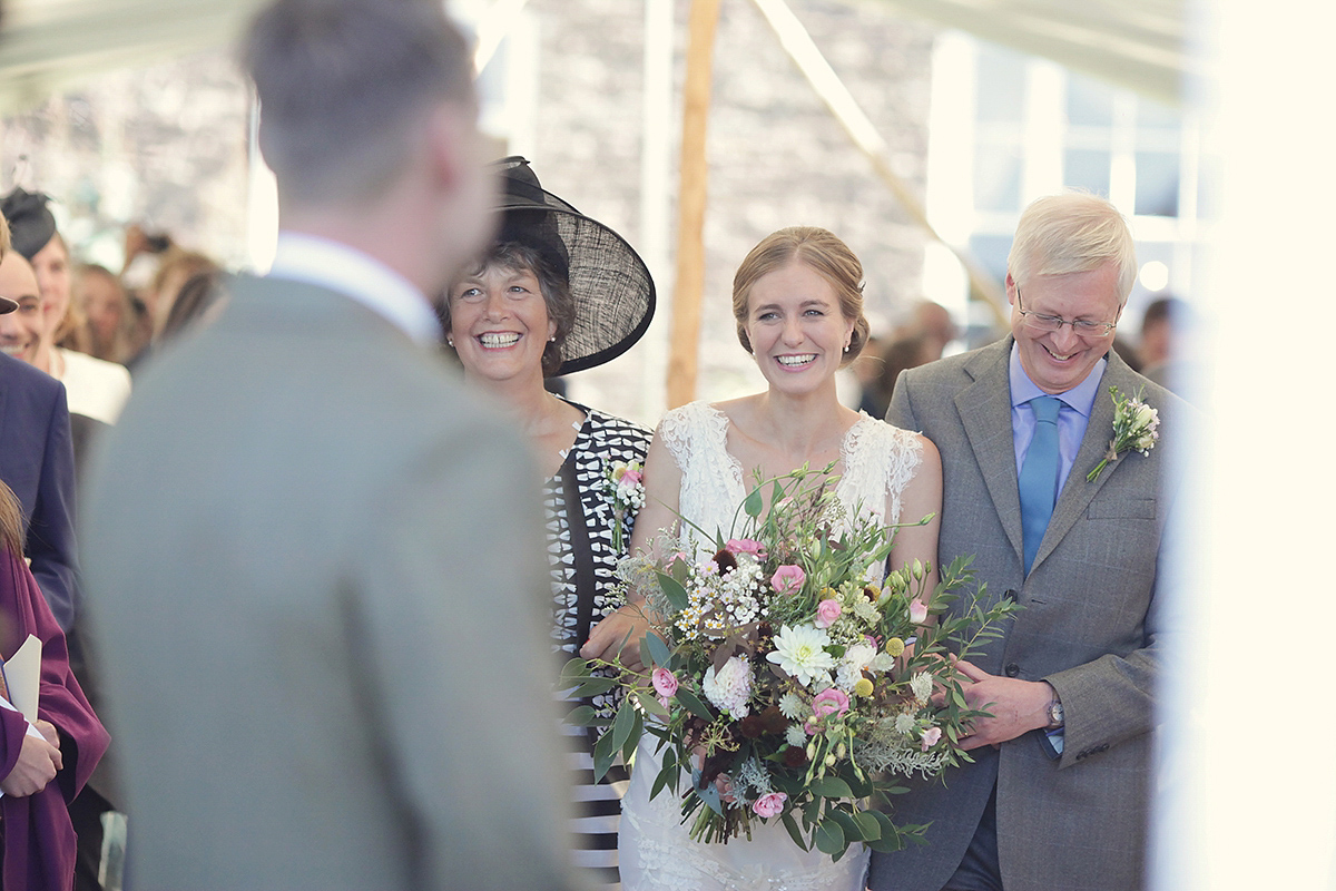 Ellie's wears a 1920's drop waist vintage dress for her outdoor, Autumn, Humanist wedding ceremony at Dewsall Court. Images by Bullit Photography.