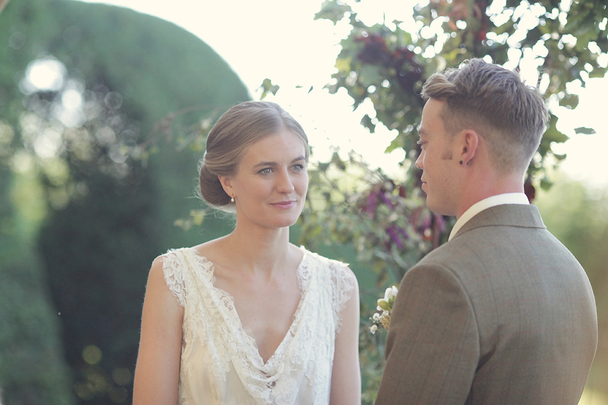 Ellie's wears a 1920's drop waist vintage dress for her outdoor, Autumn, Humanist wedding ceremony at Dewsall Court. Images by Bullit Photography.