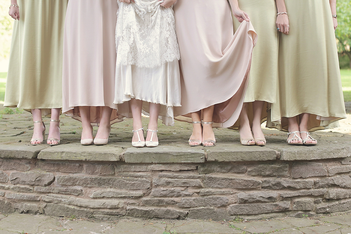 Ellie's wears a 1920's drop waist vintage dress for her outdoor, Autumn, Humanist wedding ceremony at Dewsall Court. Images by Bullit Photography.