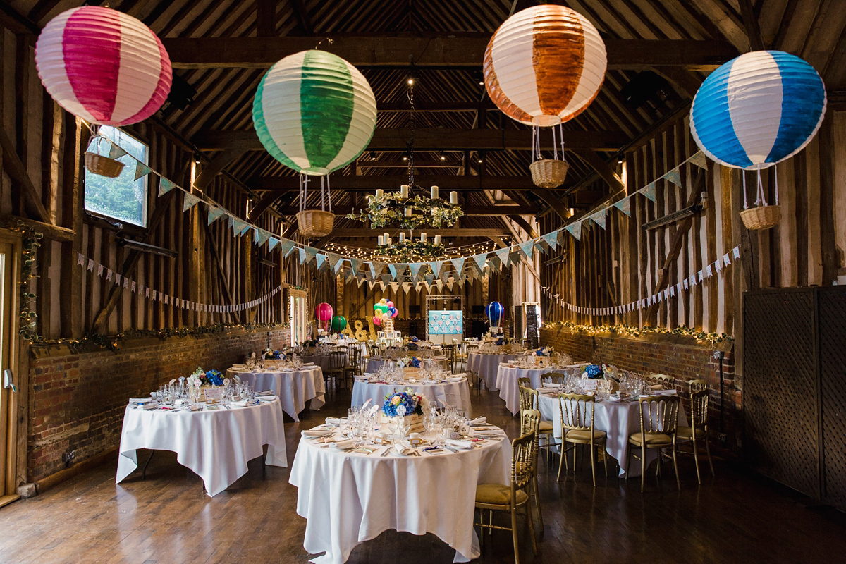 Liz wore a Vivienne Westwood dress for her hot air balloon and travel inspired wedding ('Around the World in 80 Days', Phileas Fogg style). A Lillibrooke Hall summer barn wedding, photographed by Faye Cornhill.