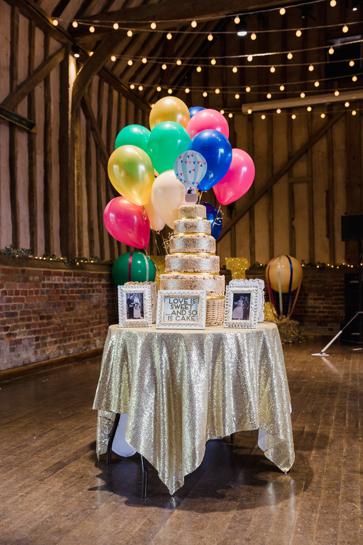 Liz wore a Vivienne Westwood dress for her hot air balloon and travel inspired wedding ('Around the World in 80 Days', Phileas Fogg style). A Lillibrooke Hall summer barn wedding, photographed by Faye Cornhill.