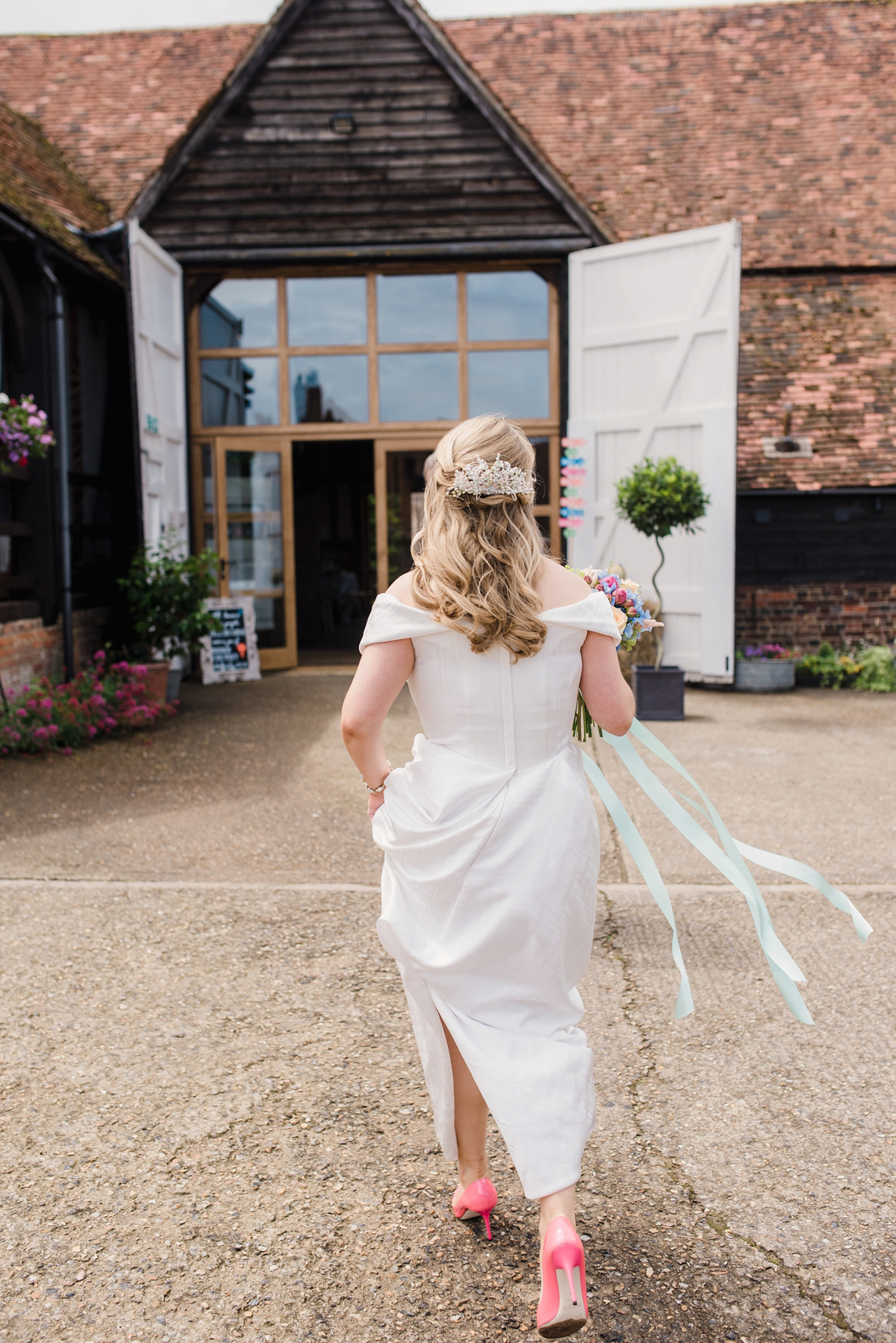 Liz wore a Vivienne Westwood dress for her hot air balloon and travel inspired wedding ('Around the World in 80 Days', Phileas Fogg style). A Lillibrooke Hall summer barn wedding, photographed by Faye Cornhill.