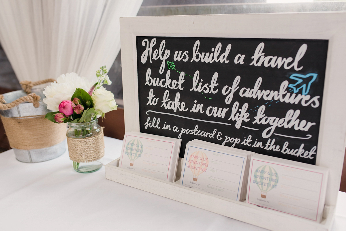 Liz wore a Vivienne Westwood dress for her hot air balloon and travel inspired wedding ('Around the World in 80 Days', Phileas Fogg style). A Lillibrooke Hall summer barn wedding, photographed by Faye Cornhill.