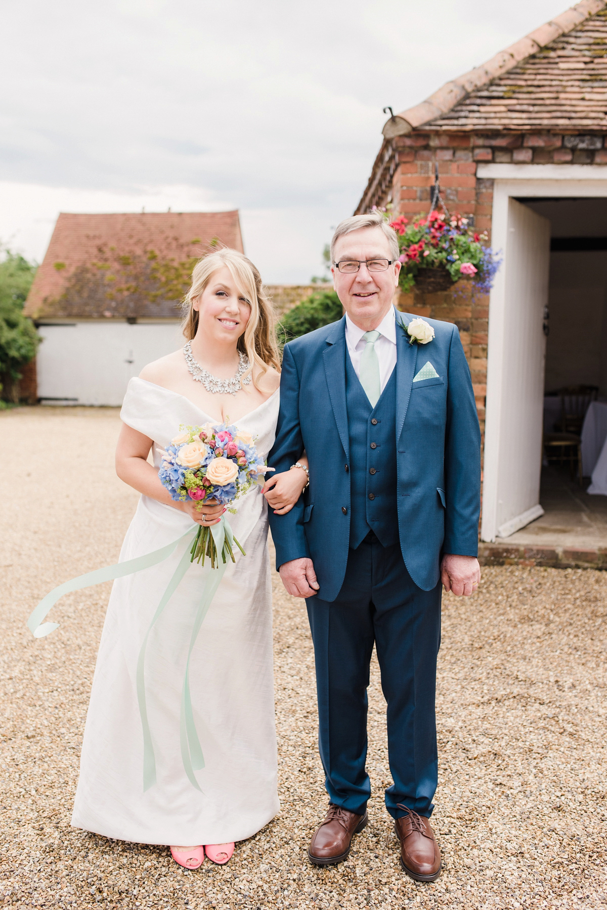 Liz wore a Vivienne Westwood dress for her hot air balloon and travel inspired wedding ('Around the World in 80 Days', Phileas Fogg style). A Lillibrooke Hall summer barn wedding, photographed by Faye Cornhill.