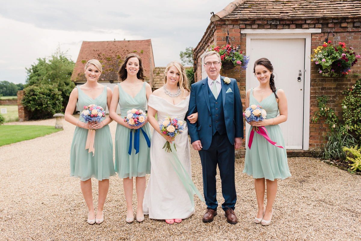 Liz wore a Vivienne Westwood dress for her hot air balloon and travel inspired wedding ('Around the World in 80 Days', Phileas Fogg style). A Lillibrooke Hall summer barn wedding, photographed by Faye Cornhill.