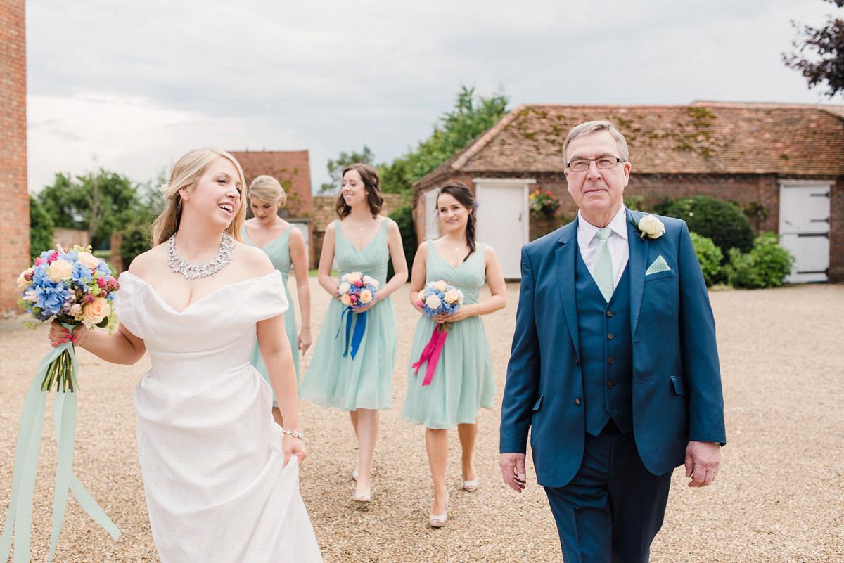 Liz wore a Vivienne Westwood dress for her hot air balloon and travel inspired wedding ('Around the World in 80 Days', Phileas Fogg style). A Lillibrooke Hall summer barn wedding, photographed by Faye Cornhill.