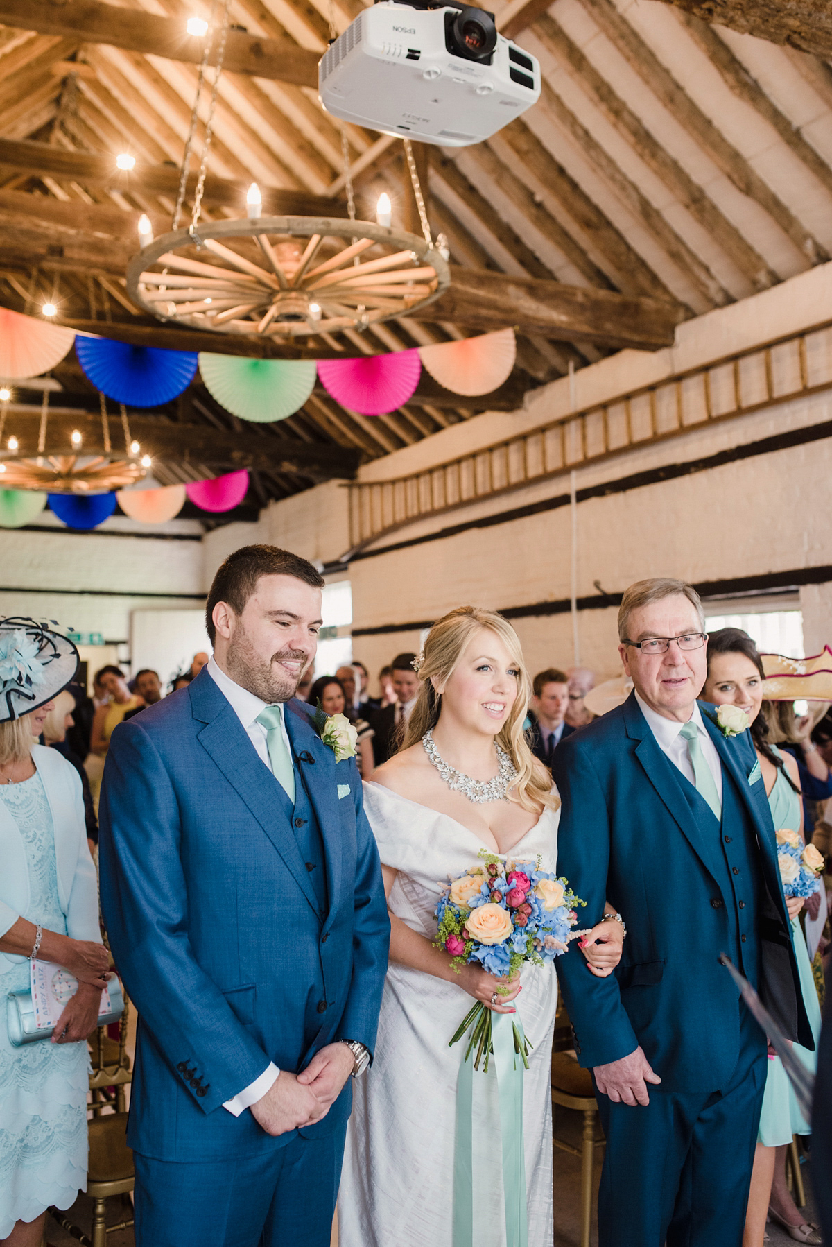 Liz wore a Vivienne Westwood dress for her hot air balloon and travel inspired wedding ('Around the World in 80 Days', Phileas Fogg style). A Lillibrooke Hall summer barn wedding, photographed by Faye Cornhill.