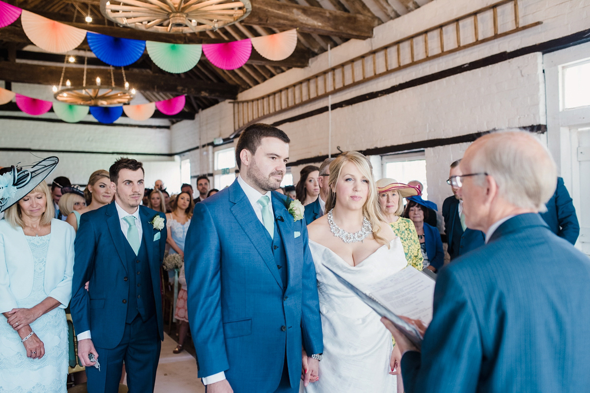 Liz wore a Vivienne Westwood dress for her hot air balloon and travel inspired wedding ('Around the World in 80 Days', Phileas Fogg style). A Lillibrooke Hall summer barn wedding, photographed by Faye Cornhill.