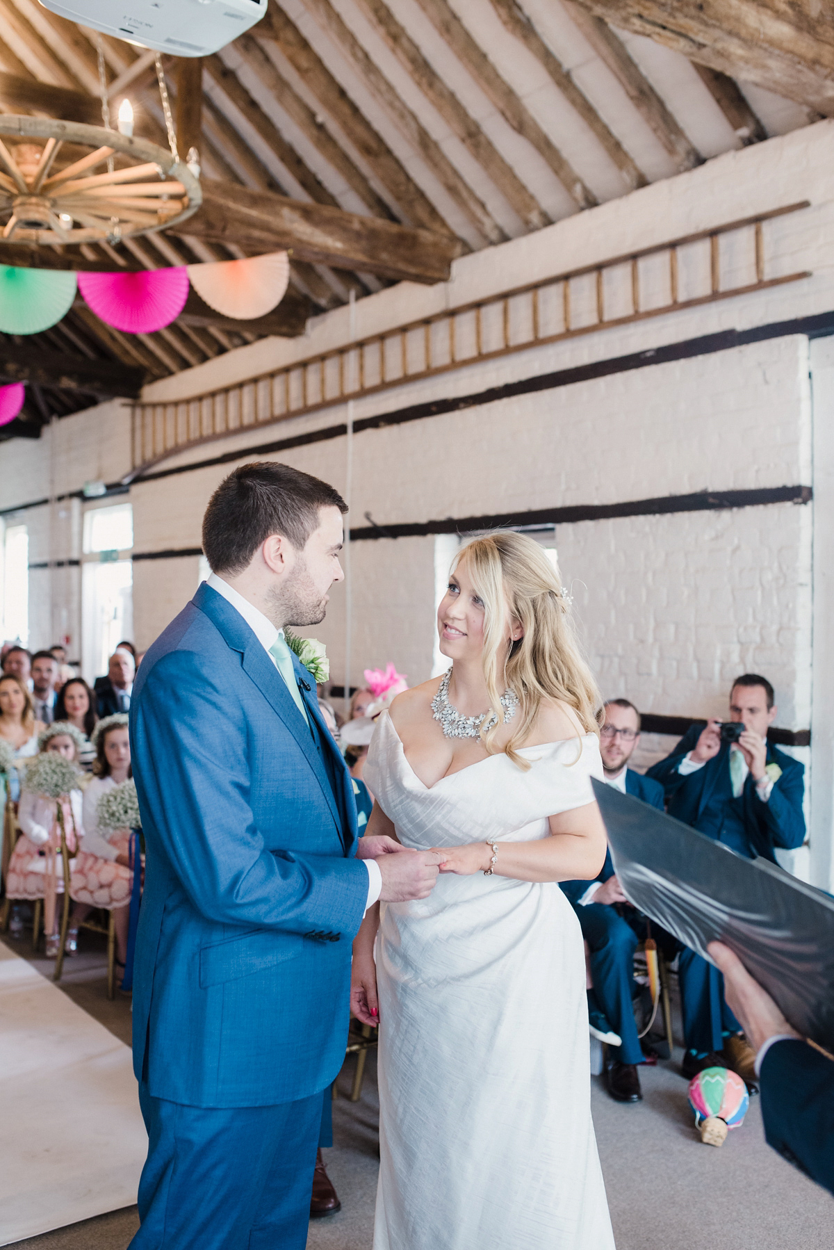 Liz wore a Vivienne Westwood dress for her hot air balloon and travel inspired wedding ('Around the World in 80 Days', Phileas Fogg style). A Lillibrooke Hall summer barn wedding, photographed by Faye Cornhill.