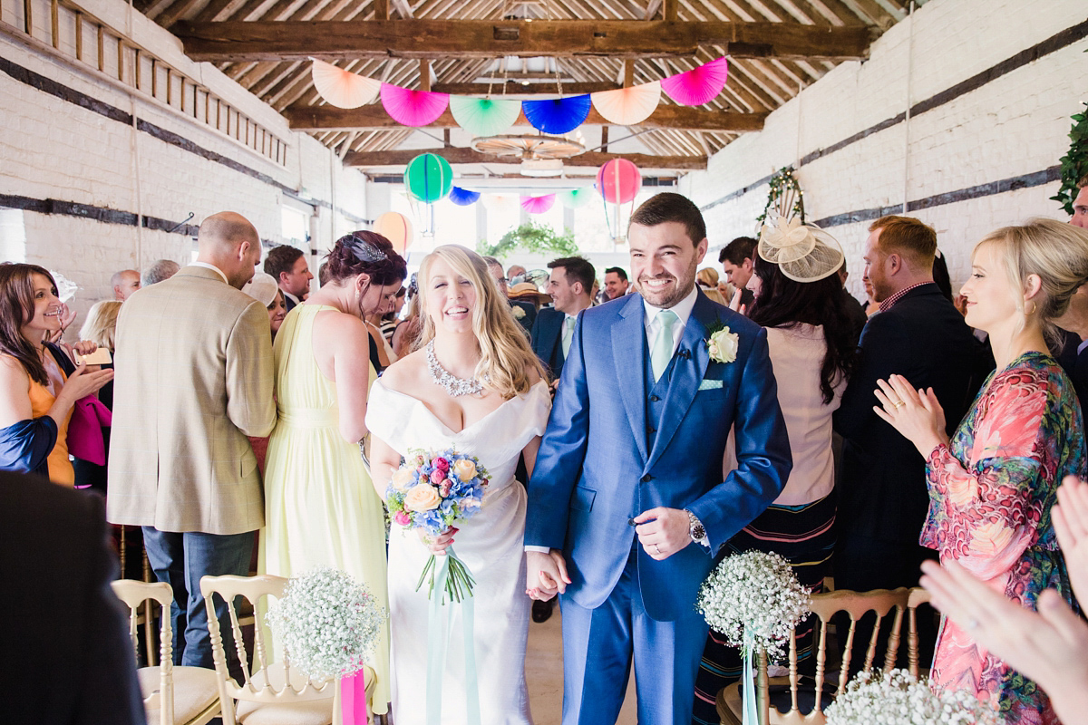 Liz wore a Vivienne Westwood dress for her hot air balloon and travel inspired wedding ('Around the World in 80 Days', Phileas Fogg style). A Lillibrooke Hall summer barn wedding, photographed by Faye Cornhill.