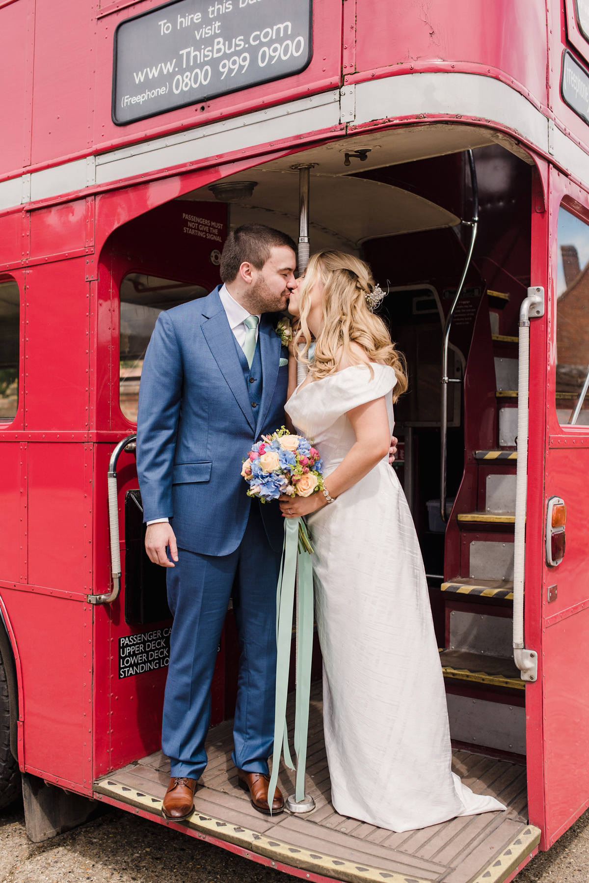 Liz wore a Vivienne Westwood dress for her hot air balloon and travel inspired wedding ('Around the World in 80 Days', Phileas Fogg style). A Lillibrooke Hall summer barn wedding, photographed by Faye Cornhill.