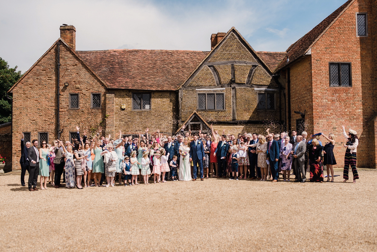 Liz wore a Vivienne Westwood dress for her hot air balloon and travel inspired wedding ('Around the World in 80 Days', Phileas Fogg style). A Lillibrooke Hall summer barn wedding, photographed by Faye Cornhill.