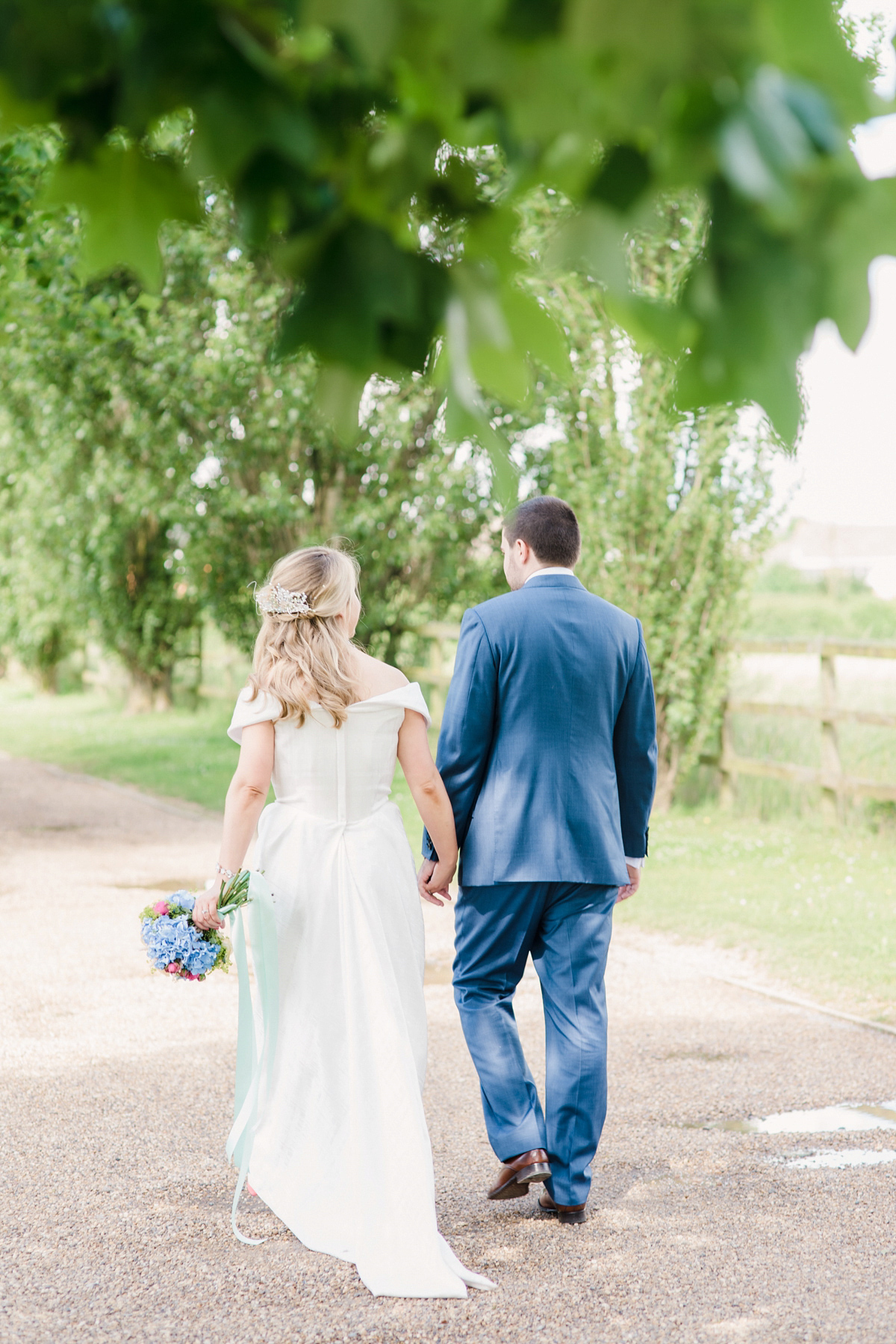 Liz wore a Vivienne Westwood dress for her hot air balloon and travel inspired wedding ('Around the World in 80 Days', Phileas Fogg style). A Lillibrooke Hall summer barn wedding, photographed by Faye Cornhill.