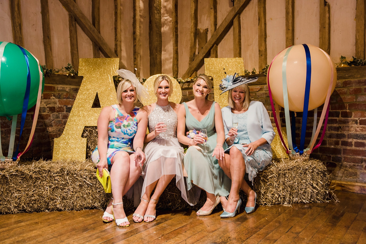 Liz wore a Vivienne Westwood dress for her hot air balloon and travel inspired wedding ('Around the World in 80 Days', Phileas Fogg style). A Lillibrooke Hall summer barn wedding, photographed by Faye Cornhill.