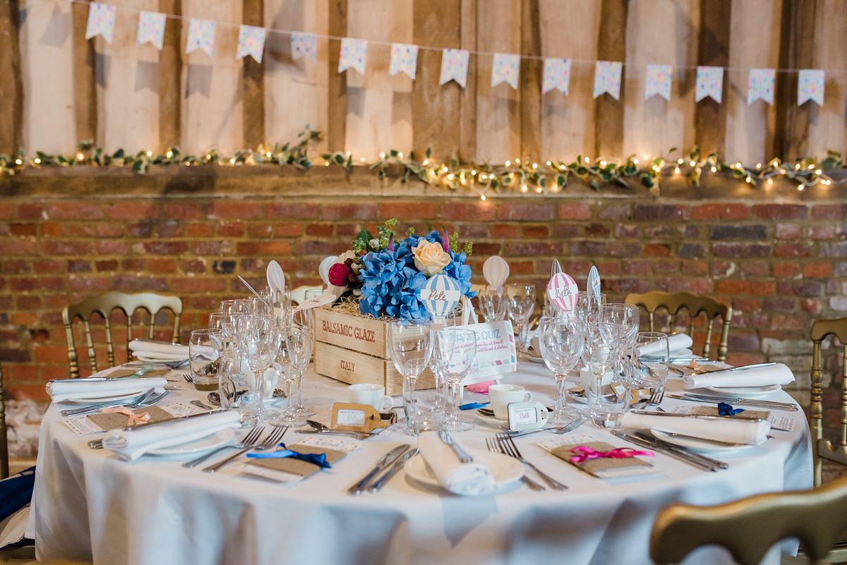 Liz wore a Vivienne Westwood dress for her hot air balloon and travel inspired wedding ('Around the World in 80 Days', Phileas Fogg style). A Lillibrooke Hall summer barn wedding, photographed by Faye Cornhill.