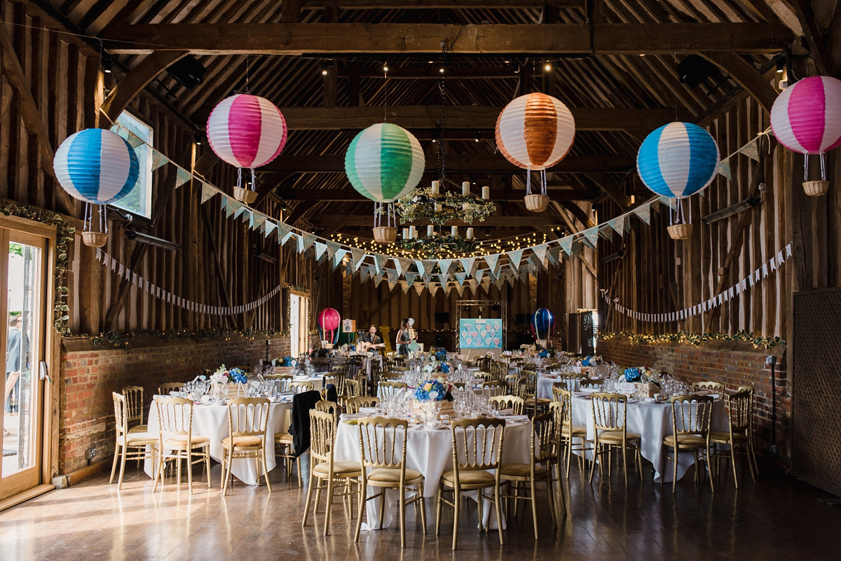 Liz wore a Vivienne Westwood dress for her hot air balloon and travel inspired wedding ('Around the World in 80 Days', Phileas Fogg style). A Lillibrooke Hall summer barn wedding, photographed by Faye Cornhill.